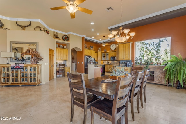 dining space featuring light tile patterned floors, visible vents, recessed lighting, arched walkways, and ornamental molding