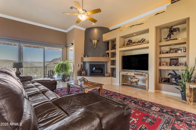 living area featuring tile patterned flooring, visible vents, a fireplace with raised hearth, built in features, and ornamental molding