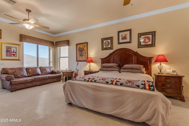 carpeted bedroom with ceiling fan, visible vents, and ornamental molding