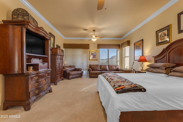 bedroom with visible vents, light colored carpet, ceiling fan, and ornamental molding