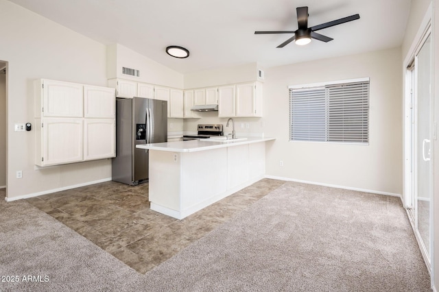 3324 S Parkside Dr, Tempe, AZ 85282 - kitchen featuring appliances with stainless steel finishes, ceiling fan, carpet, a peninsula, and white cabinets