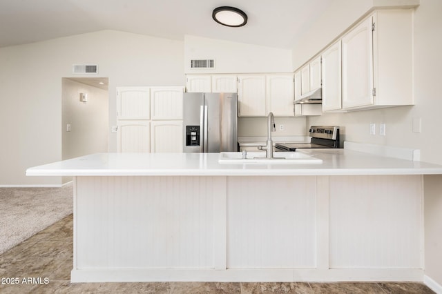 3324 S Parkside Dr, Tempe, AZ 85282 - kitchen featuring appliances with stainless steel finishes, under cabinet range hood, lofted ceiling, a peninsula, and light countertops