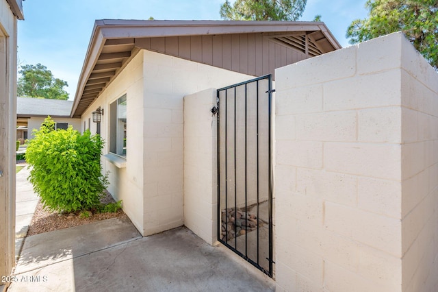 3324 S Parkside Dr, Tempe, AZ 85282 - view of side of home with concrete block siding and a gate