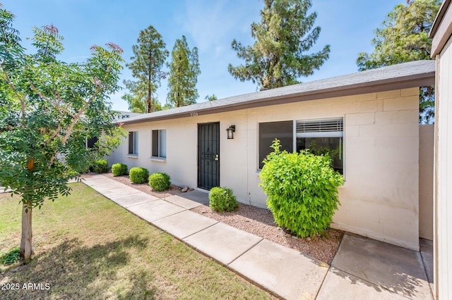 3324 S Parkside Dr, Tempe, AZ 85282 - property entrance featuring a lawn and concrete block siding