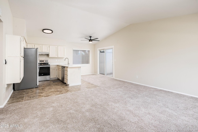 3324 S Parkside Dr, Tempe, AZ 85282 - kitchen featuring appliances with stainless steel finishes, a peninsula, a ceiling fan, light colored carpet, and open floor plan