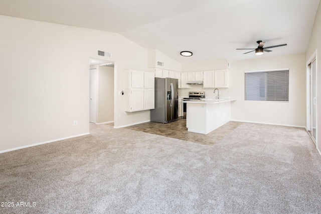 3324 S Parkside Dr, Tempe, AZ 85282 - kitchen featuring stainless steel appliances, open floor plan, light colored carpet, ceiling fan, and a peninsula
