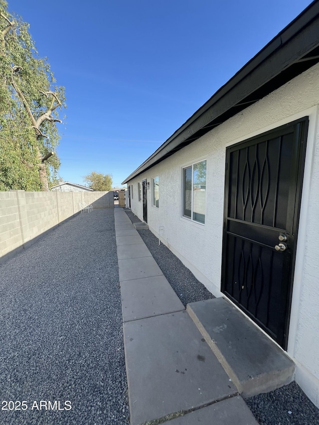 view of property exterior with a patio