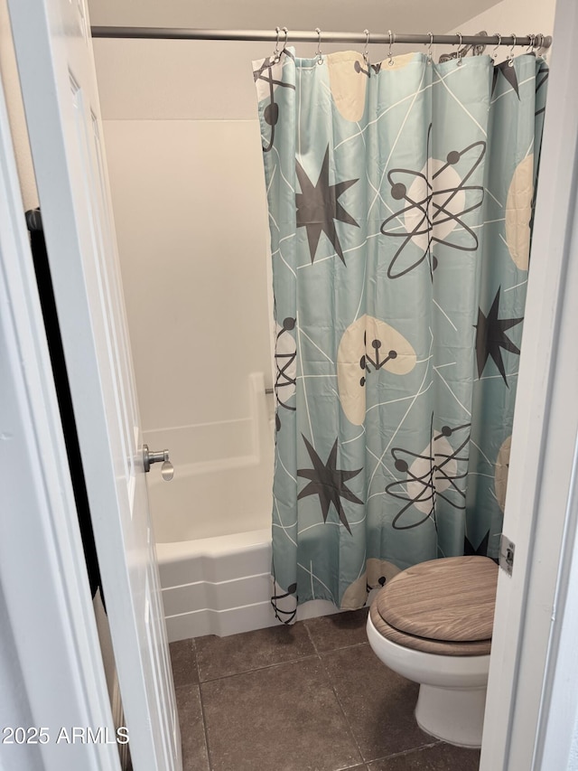 3825 E Camelback Rd Unit 152, Phoenix, AZ 85018 - bathroom featuring toilet, shower / tub combo, and tile patterned floors