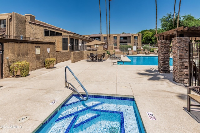 3825 E Camelback Rd Unit 152, Phoenix, AZ 85018 - community pool featuring a patio and a community hot tub