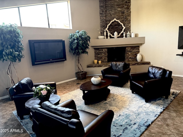 3825 E Camelback Rd Unit 152, Phoenix, AZ 85018 - living room featuring baseboards and a fireplace