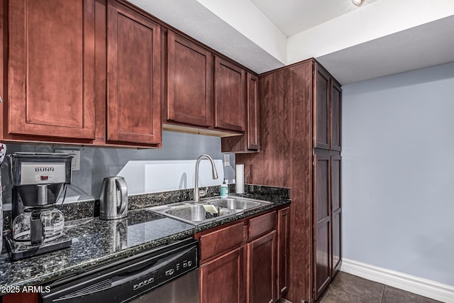 3825 E Camelback Rd Unit 152, Phoenix, AZ 85018 - kitchen with stainless steel dishwasher, a sink, dark stone countertops, baseboards, and dark tile patterned flooring