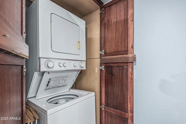 3825 E Camelback Rd Unit 152, Phoenix, AZ 85018 - washroom with stacked washing machine and dryer