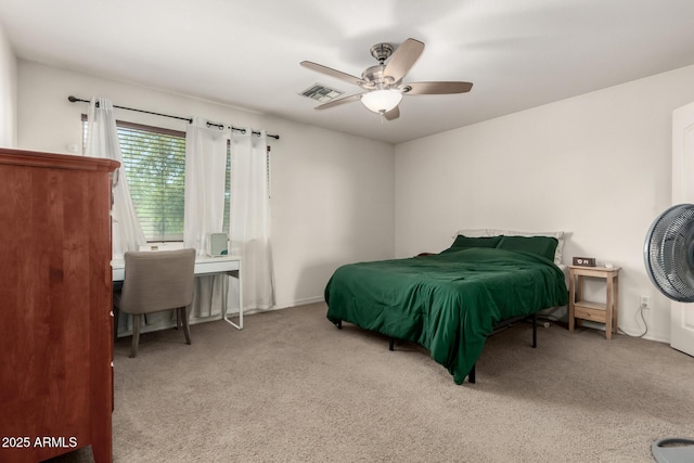 carpeted bedroom with visible vents and a ceiling fan