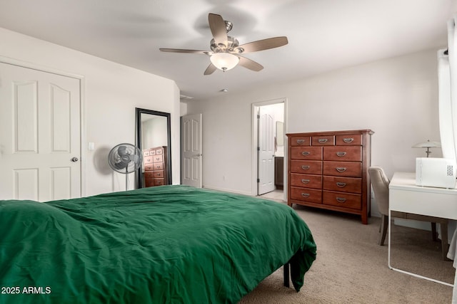bedroom with light carpet and a ceiling fan