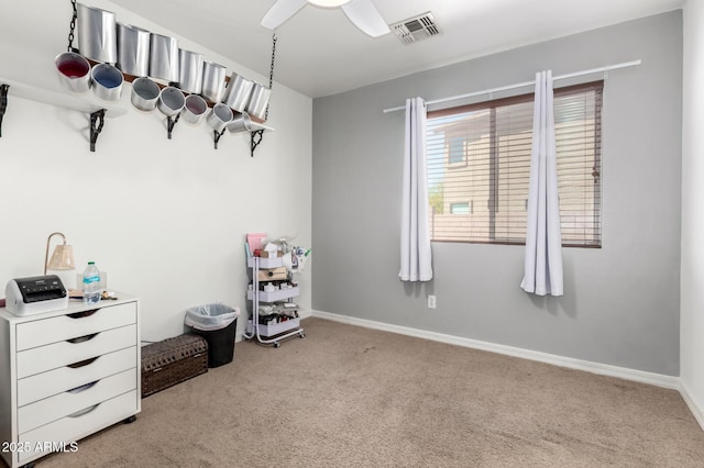 carpeted bedroom featuring ceiling fan, baseboards, and visible vents