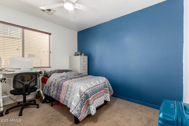 bedroom featuring carpet, visible vents, baseboards, and ceiling fan