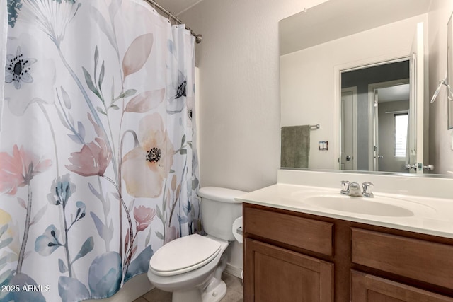 bathroom with vanity, toilet, and a shower with curtain