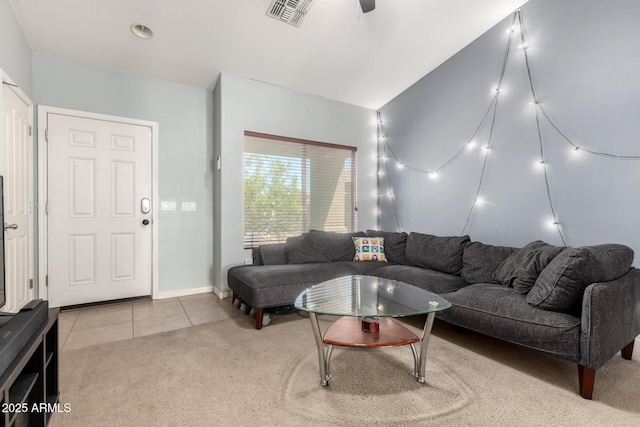 tiled living room with a ceiling fan, visible vents, and carpet floors