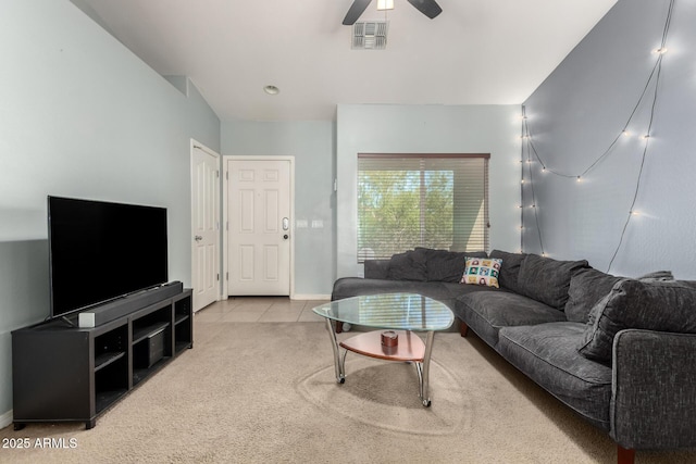 carpeted living room with visible vents, tile patterned flooring, baseboards, and ceiling fan