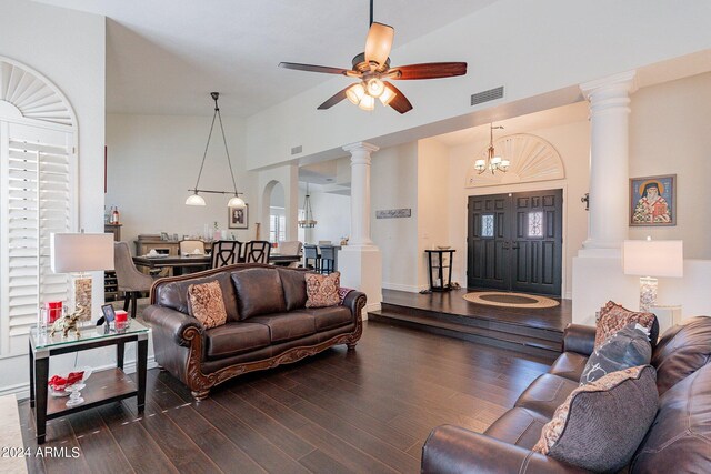 living room featuring dark hardwood / wood-style flooring, a fireplace, lofted ceiling, and ceiling fan