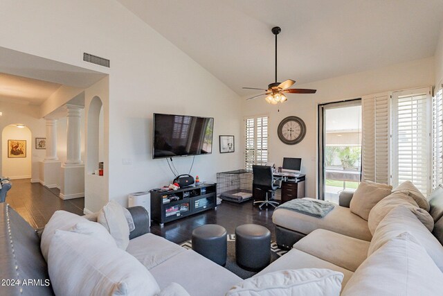 dining room with high vaulted ceiling, ceiling fan, decorative columns, and dark hardwood / wood-style floors