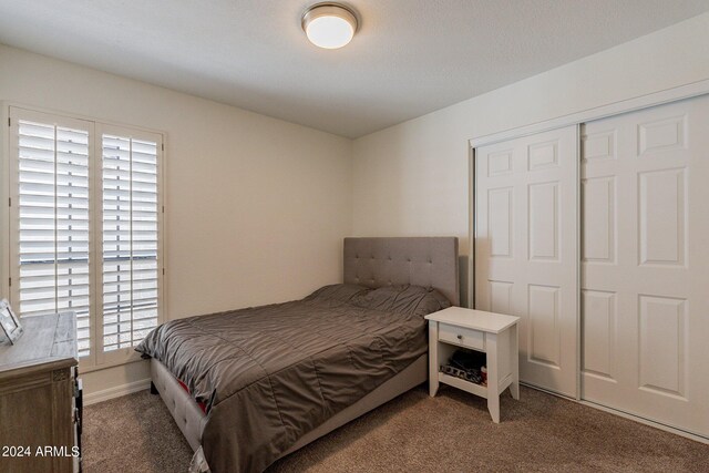 carpeted bedroom with ceiling fan and lofted ceiling