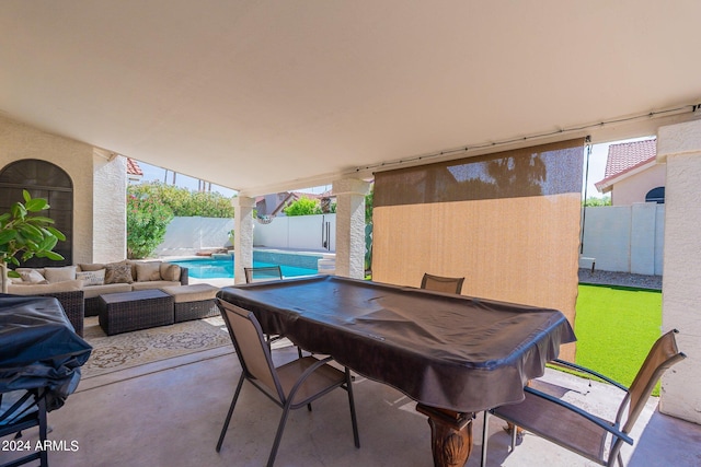 view of patio / terrace with outdoor lounge area and a fenced in pool