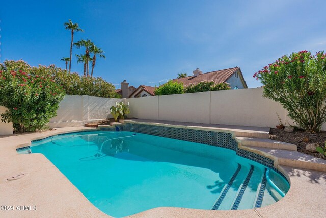 view of patio / terrace with an outdoor living space and a fenced in pool