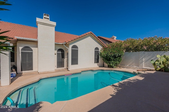 view of pool featuring a patio