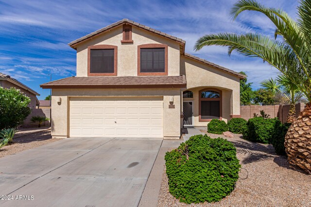 view of front of home with a garage