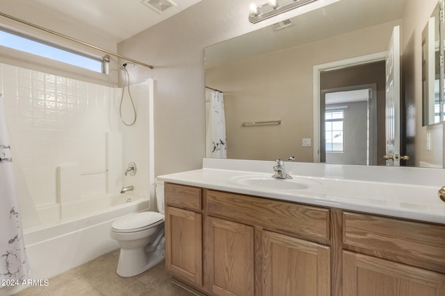 full bathroom with vanity, tile patterned floors, shower / bath combo with shower curtain, and toilet