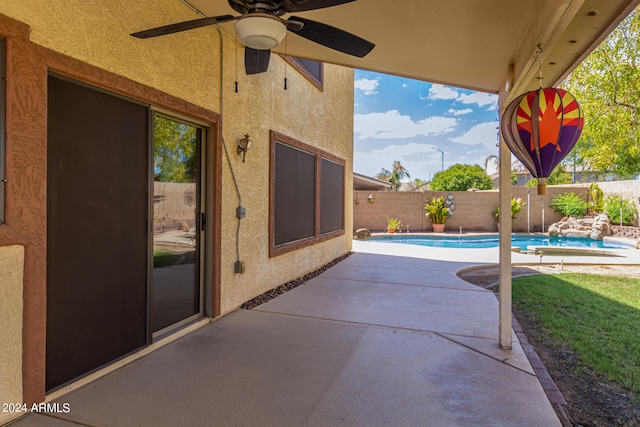 view of patio with a fenced in pool