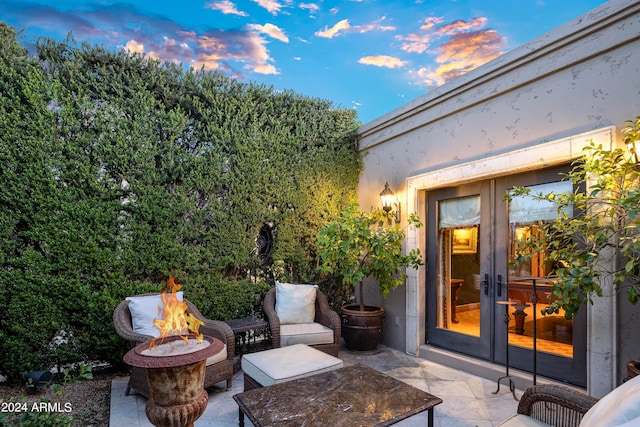 patio terrace at dusk with an outdoor fire pit