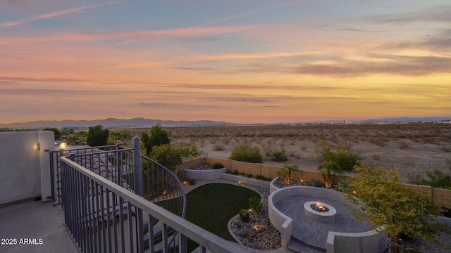 balcony featuring an outdoor fire pit and a mountain view