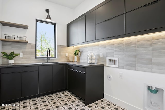 kitchen with light tile patterned flooring and sink