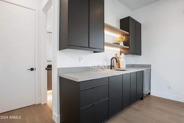 kitchen with light wood-type flooring and sink