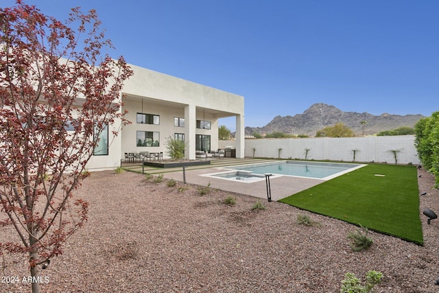 view of pool with a patio area and a mountain view