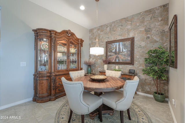 dining room with vaulted ceiling