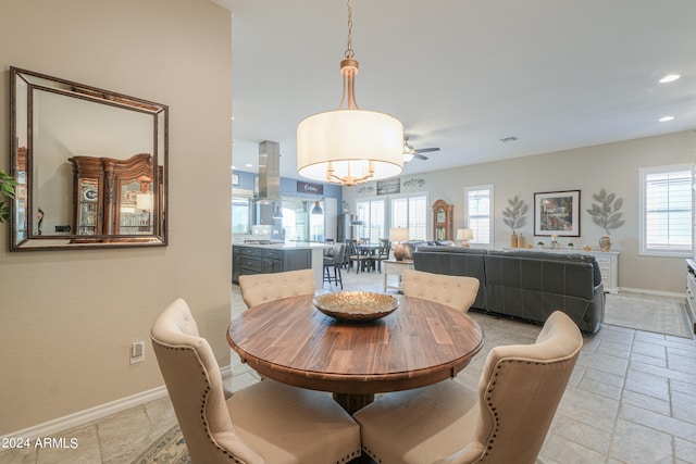 dining space featuring ceiling fan