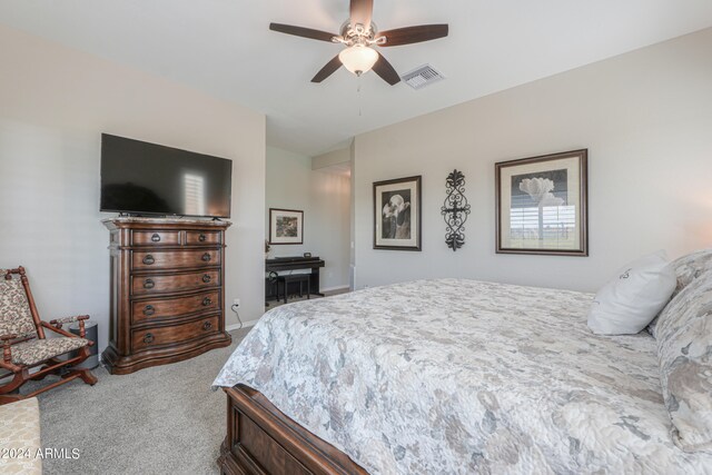 carpeted bedroom with ceiling fan