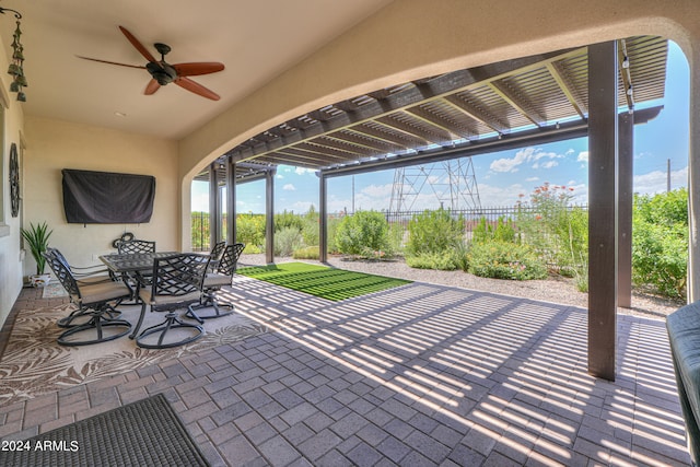 view of patio featuring ceiling fan