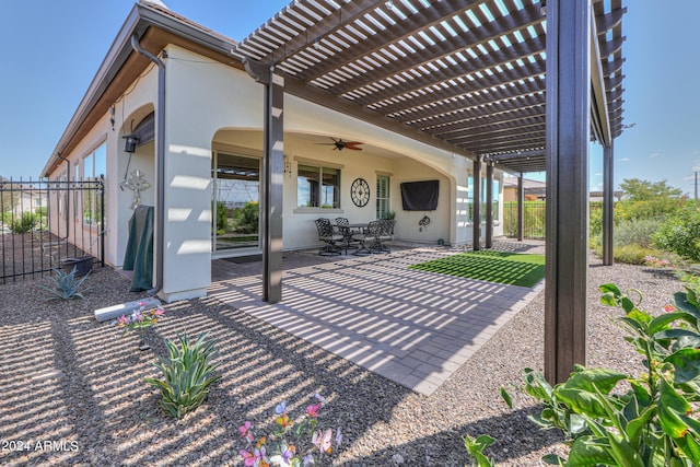 view of patio / terrace with a pergola and ceiling fan