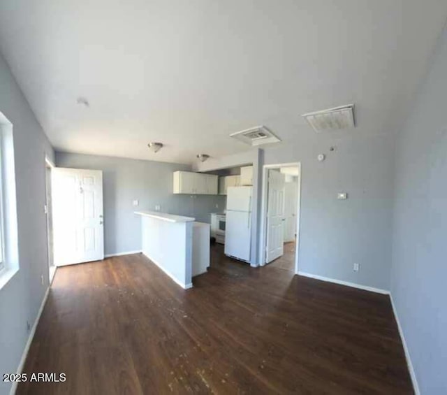 417 N 18th Dr, Phoenix, AZ 85007 - unfurnished living room featuring dark wood finished floors and baseboards