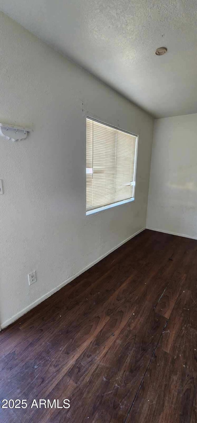 417 N 18th Dr, Phoenix, AZ 85007 - spare room with hardwood / wood-style floors, a textured ceiling, and baseboards