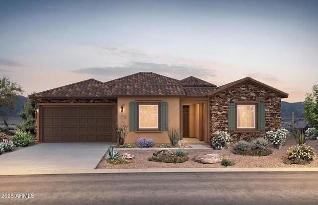 ranch-style house featuring driveway, an attached garage, and stucco siding