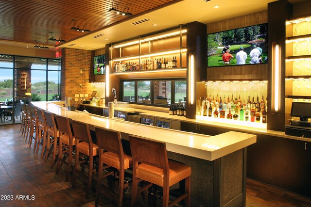 7870 W Mockingbird Way, Florence, AZ 85132 - bar featuring wet bar, visible vents, and a wealth of natural light