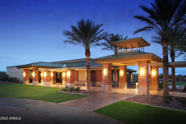 7870 W Mockingbird Way, Florence, AZ 85132 - view of front of home featuring metal roof, a standing seam roof, and a front yard