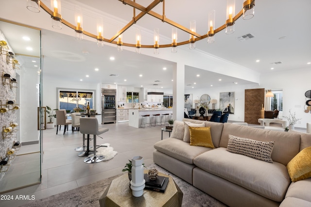 living room featuring a notable chandelier