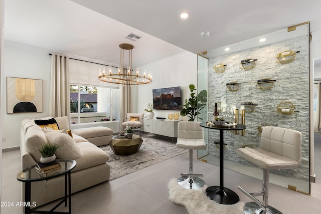 living room featuring ornamental molding and a chandelier