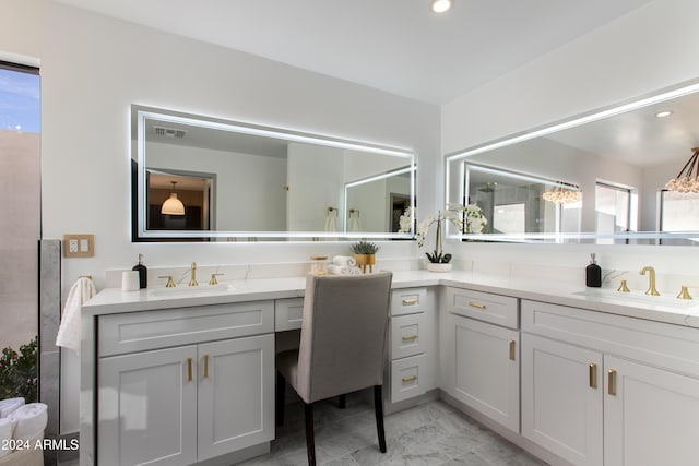 bathroom with vanity and a healthy amount of sunlight